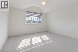 Bonus room with carpet flooring and vaulted ceiling - 