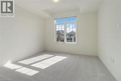 Carpeted empty room with baseboards - 