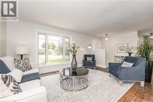 Hardwood-finish flooring, white trim, and a bay window - 388 Appleby Line, Burlington, ON 