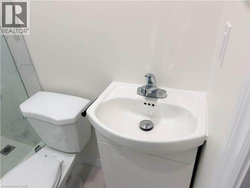 White vanity with integrated basin and chrome faucet - 304 Westpark Crescent, Waterloo, ON 