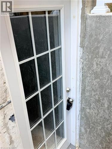 White grid-paneled door with brushed nickel hardware - 304 Westpark Crescent, Waterloo, ON 