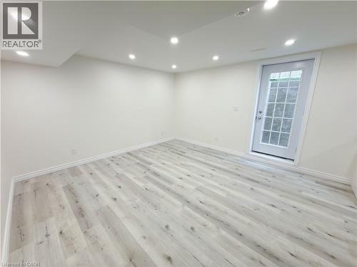 Recessed lighting, light wood-finish flooring, white walls, and a glass-paneled exterior door - 304 Westpark Crescent, Waterloo, ON 