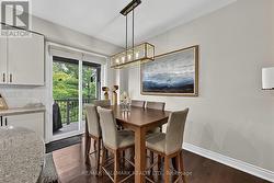 Dining area w walk out to balcony w bar b que. - 