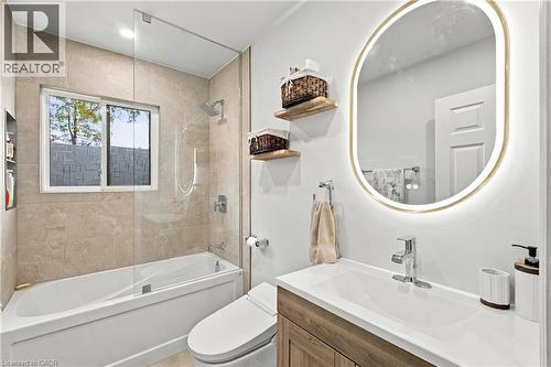 Glass-enclosed tub and shower combination with a rainfall shower head - 617 Scenic Drive, Hamilton, ON 