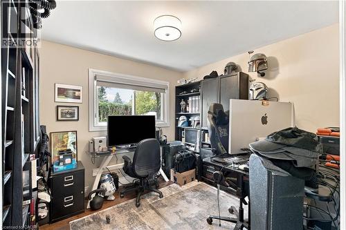 Recessed lighting, wood-finish flooring, and a large window providing natural illumination - 617 Scenic Drive, Hamilton, ON 