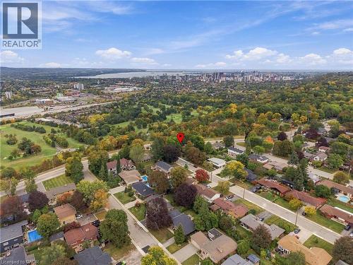 Expansive residential area featuring established homes, mature trees, and a distant cityscape - 617 Scenic Drive, Hamilton, ON 