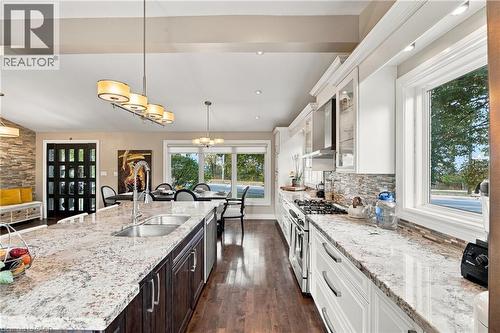Expansive kitchen island with an undermount double-basin sink and integrated dishwasher - 617 Scenic Drive, Hamilton, ON 