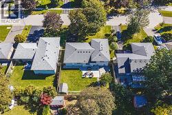 Expansive lot featuring a large lawn area and mature perimeter trees - 