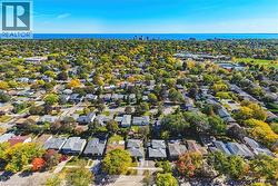 Expansive residential area with a diverse collection of homes, mature trees, and visible streets - 