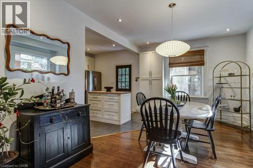 Hardwood flooring, recessed lighting, modern pendant light fixture, wood-framed windows, and built-in cabinetry - 43 Rosslyn Avenue S, Hamilton, ON 