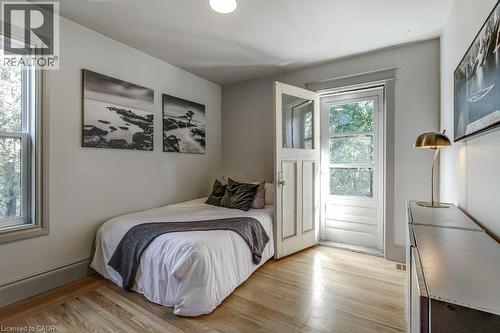 Hardwood flooring, painted trim, recessed lighting, and a glass-paneled door - 43 Rosslyn Avenue S, Hamilton, ON 