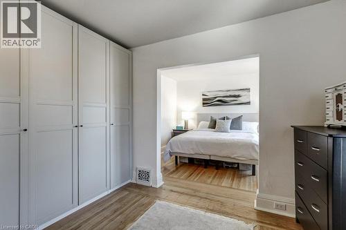 Built-in cabinetry with paneling, wood-finish flooring - 43 Rosslyn Avenue S, Hamilton, ON 