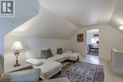 Sloped ceiling architecture with painted wood-finish flooring - 43 Rosslyn Avenue S, Hamilton, ON 