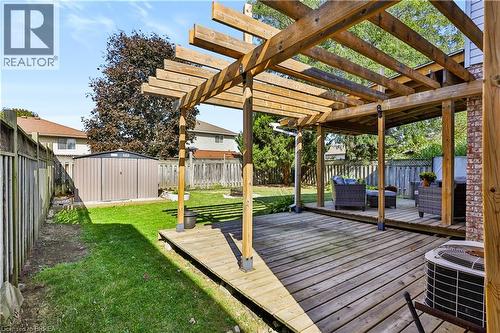 Expansive wooden deck with an integrated wood pergola - 19 Hyslop Drive, Caledonia, ON 
