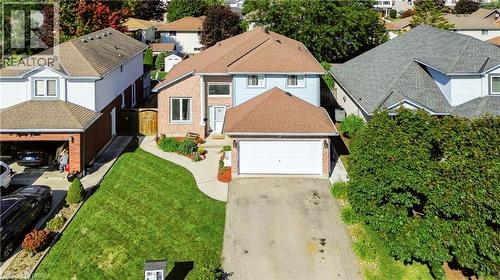 Brick and siding facade with an attached garage - 19 Hyslop Drive, Caledonia, ON 