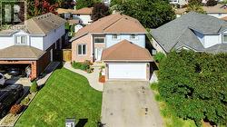Brick and siding facade with an attached garage - 