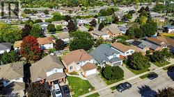 Residential neighborhood with mature trees and paved streets - 
