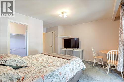 Neutral-toned walls enhance the space, complemented by a ceiling-mounted light fixture - 8 Bonnylyn Drive, Kitchener, ON 