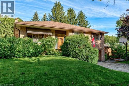 Brick exterior with a brown roof and a front awning - 8 Bonnylyn Drive, Kitchener, ON 