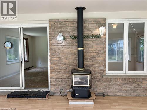 sun room - 90 Queensway E, Simcoe, ON - Indoor Photo Showing Other Room With Fireplace