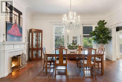 Large windows with shutters - 39 Yates Street, St. Catharines (Downtown), ON - Indoor Photo Showing Dining Room With Fireplace