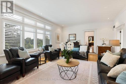 Expansive windows with california shutters - 39 Yates Street, St. Catharines (Downtown), ON - Indoor Photo Showing Living Room