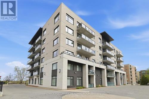 206 - 310 Centrum Boulevard, Ottawa, ON - Outdoor With Balcony With Facade