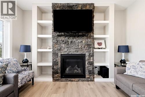 5148 Green Crescent, Regina, SK - Indoor Photo Showing Living Room With Fireplace