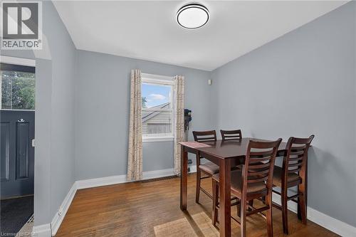 Hardwood flooring, single pane window, flush mount ceiling light fixture, and light gray wall paint - 75 Barons Avenue S, Hamilton, ON 