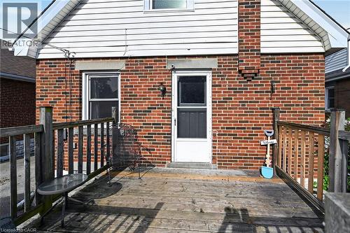 Exterior brick finish with white siding gable - 75 Barons Avenue S, Hamilton, ON 