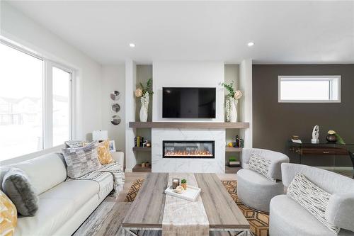 81 Ken Oblik Drive, Winnipeg, MB - Indoor Photo Showing Living Room With Fireplace