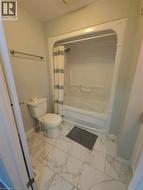 White ceramic tile flooring with grey veining - 