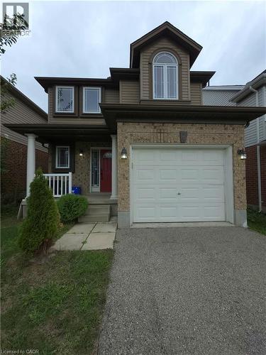 Front elevation with brick and siding facade, integrated garage, and a peaked dormer window - 998 Mapleridge Street, London, ON - Outdoor With Facade