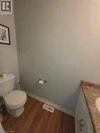 Wood-finish flooring with white trim - 
