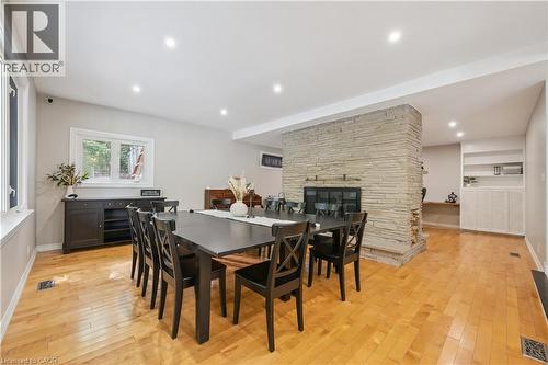 Hardwood flooring, recessed lighting, and a stone-clad fireplace - 267 Abraham Street, Cambridge, ON - Indoor Photo Showing Dining Room