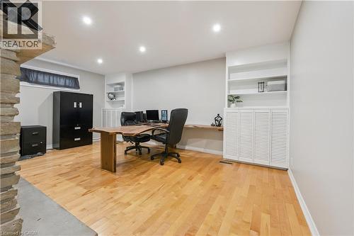 Recessed lighting, wood-finish flooring, built-in shelving, white louvered cabinetry, and a stone-clad pillar - 267 Abraham Street, Cambridge, ON - Indoor