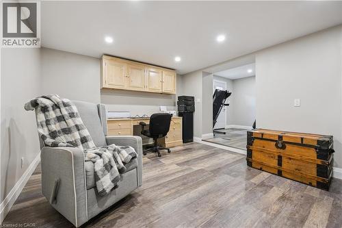 Wood-finish flooring with recessed lighting, built-in cabinetry, and a separate elevated area - 267 Abraham Street, Cambridge, ON - Indoor