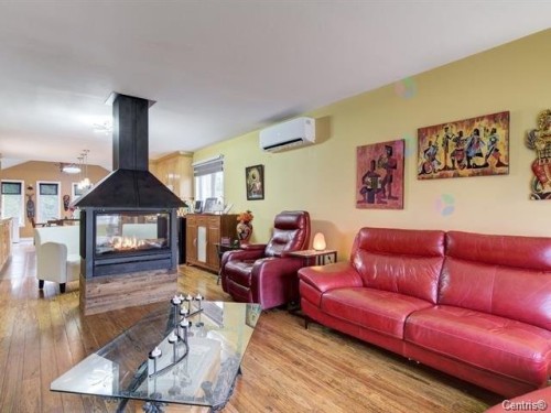 Salon - 87  - 89 Place Du Refuge, Sainte-Adèle, QC - Indoor Photo Showing Living Room With Fireplace