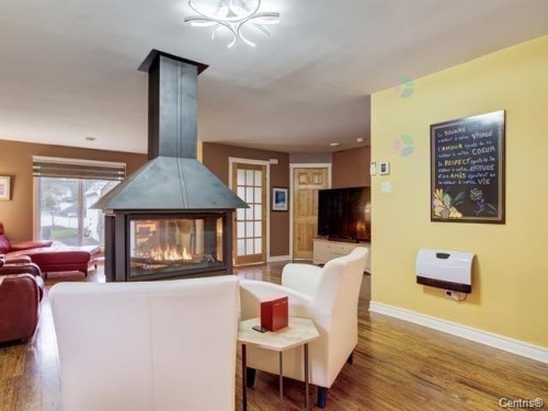 Salon - 87  - 89 Place Du Refuge, Sainte-Adèle, QC - Indoor Photo Showing Living Room With Fireplace