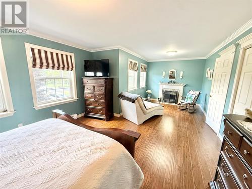 304 Grenfell Heights, Grand Falls-Windsor, NL - Indoor Photo Showing Bedroom With Fireplace