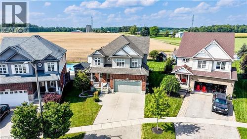 Brick and siding exterior with multiple gables, an attached garage, and a concrete driveway - 64 Kropf Drive, Baden, ON - Outdoor With Facade