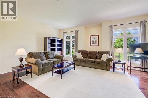 Hardwood flooring, recessed lighting, and large windows - 64 Kropf Drive, Baden, ON - Indoor Photo Showing Living Room