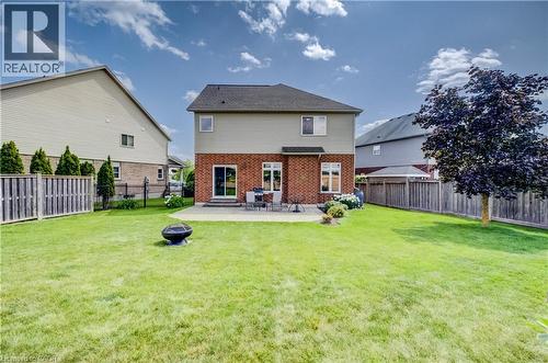Spacious backyard featuring a manicured lawn, paver patio, , and wood fencing - 64 Kropf Drive, Baden, ON - Outdoor