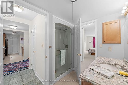 Walk in shower, door to primary bedroom and hal - 207 - 23 Rogers Road, Perth, ON - Indoor