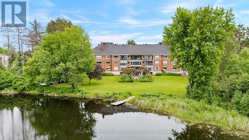 Back of the building from the Tay River - 207 - 23 Rogers Road, Perth, ON - Outdoor