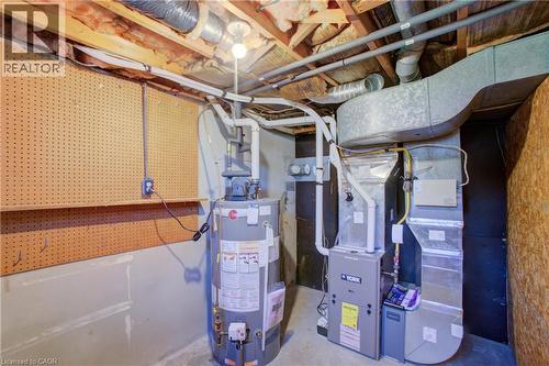 Water heater and furnace with exposed ductwork and utility piping - 52 Queenston Crescent, Kitchener, ON - Indoor Photo Showing Basement