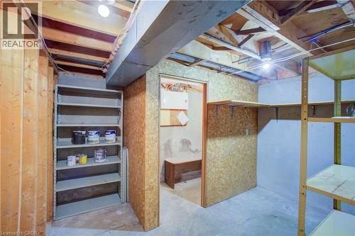 Exposed wood framing, multiple overhead light fixtures, and built-in shelving units - 52 Queenston Crescent, Kitchener, ON - Indoor
