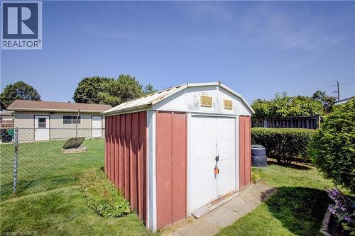 Shed with double doors and dual upper vents, set on a concrete pad - 52 Queenston Crescent, Kitchener, ON - Outdoor With Exterior
