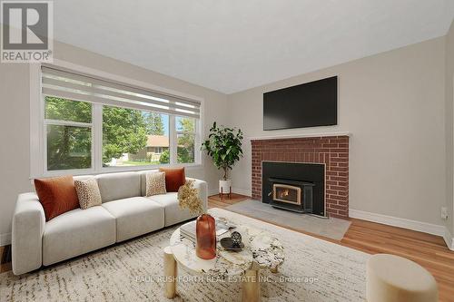 Virtually Staged-Living Room - 1072 Richard Avenue, Ottawa, ON - Indoor Photo Showing Living Room With Fireplace