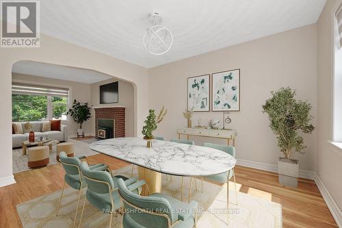 Virtually Staged-Dining Room/Living Room - 1072 Richard Avenue, Ottawa, ON - Indoor Photo Showing Dining Room With Fireplace